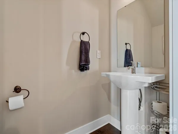 a bathroom with a sink and mirror