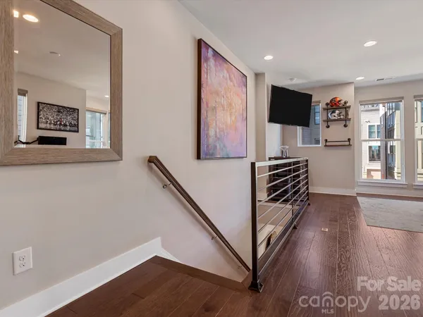 a view of entryway with wooden floor and stairs