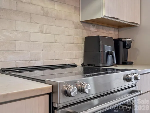 closeup of a stove top oven sitting inside of a kitchen