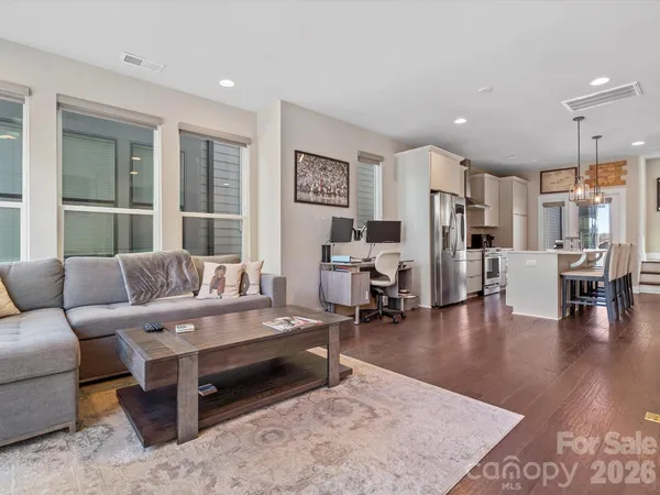 a living room with furniture and a table