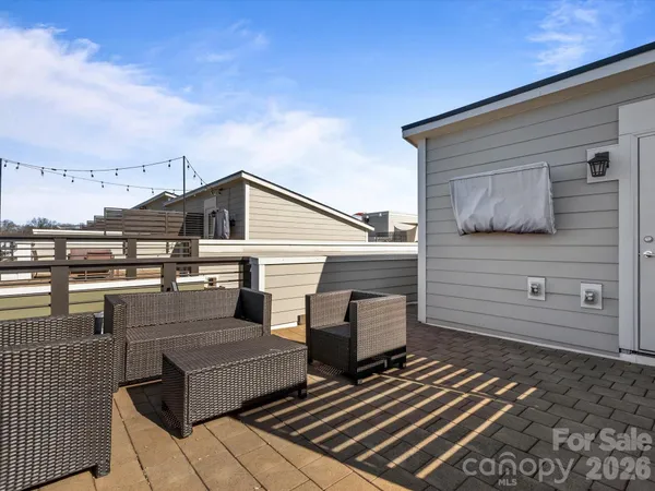 a view of a terrace with wooden floor and seating space
