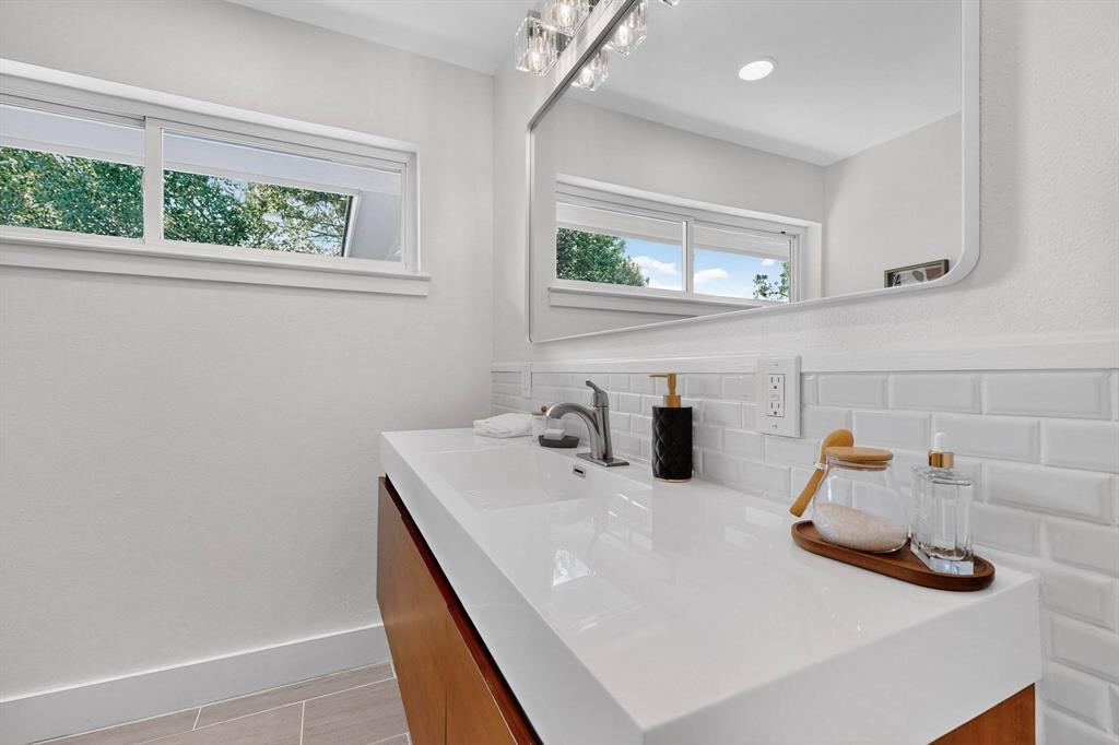 1808 Greenwood Road McKinney, TX 75069 - Photo 28 of 40 a bathroom with a sink and a window