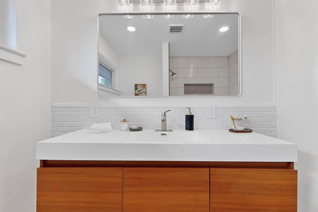 1808 Greenwood Road McKinney, TX 75069 - Photo 29 of 40 a bathroom with a sink and a mirror