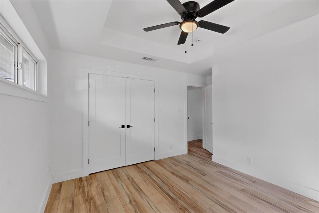 1808 Greenwood Road McKinney, TX 75069 - Photo 33 of 40 a view of an empty room with a window and wooden floor