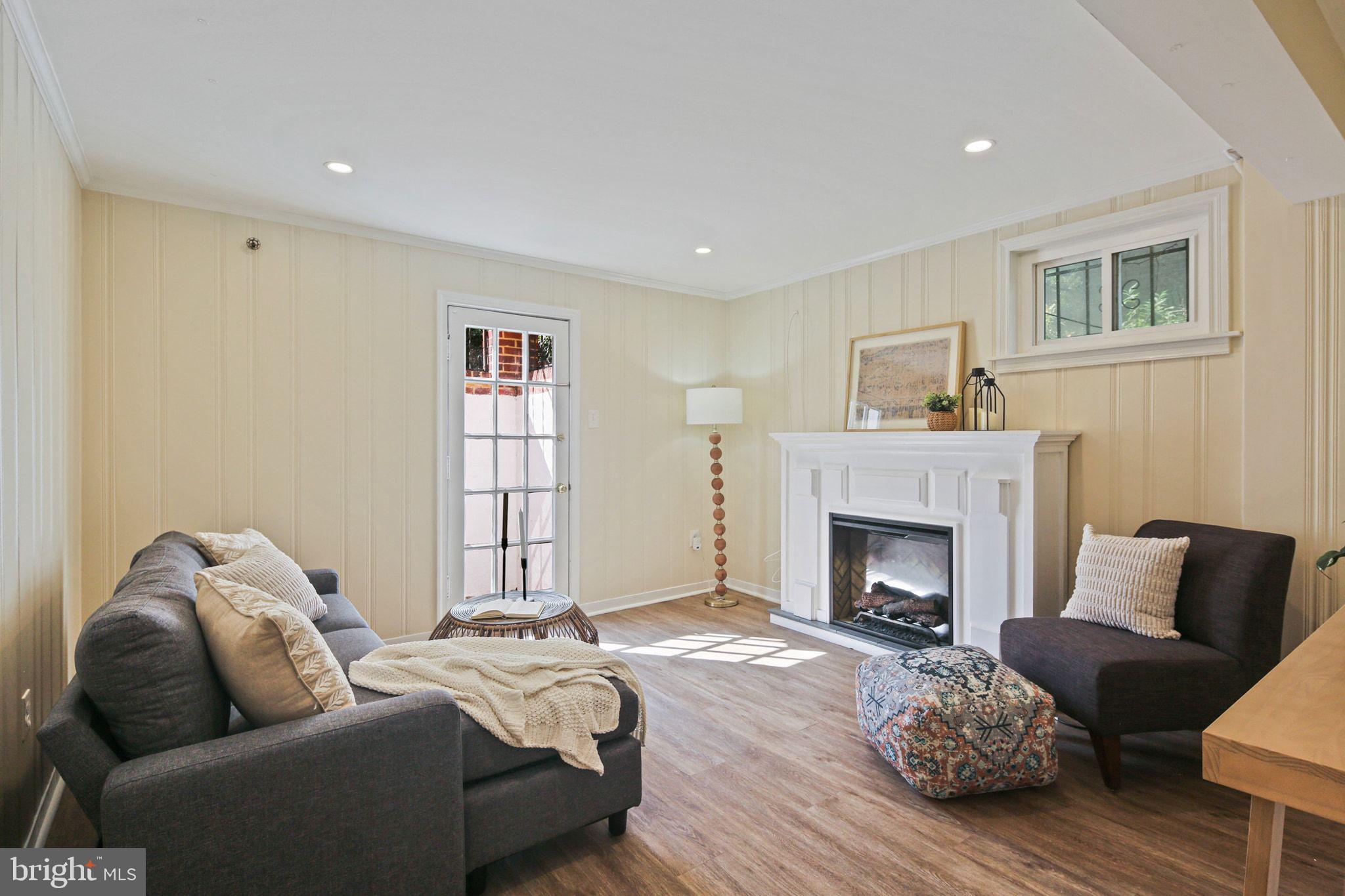 2300 Homestead Drive Silver Spring, MD 20902 - Photo 20 of 37 Lower Level Rec Room- Fireplace Furniture Conveys