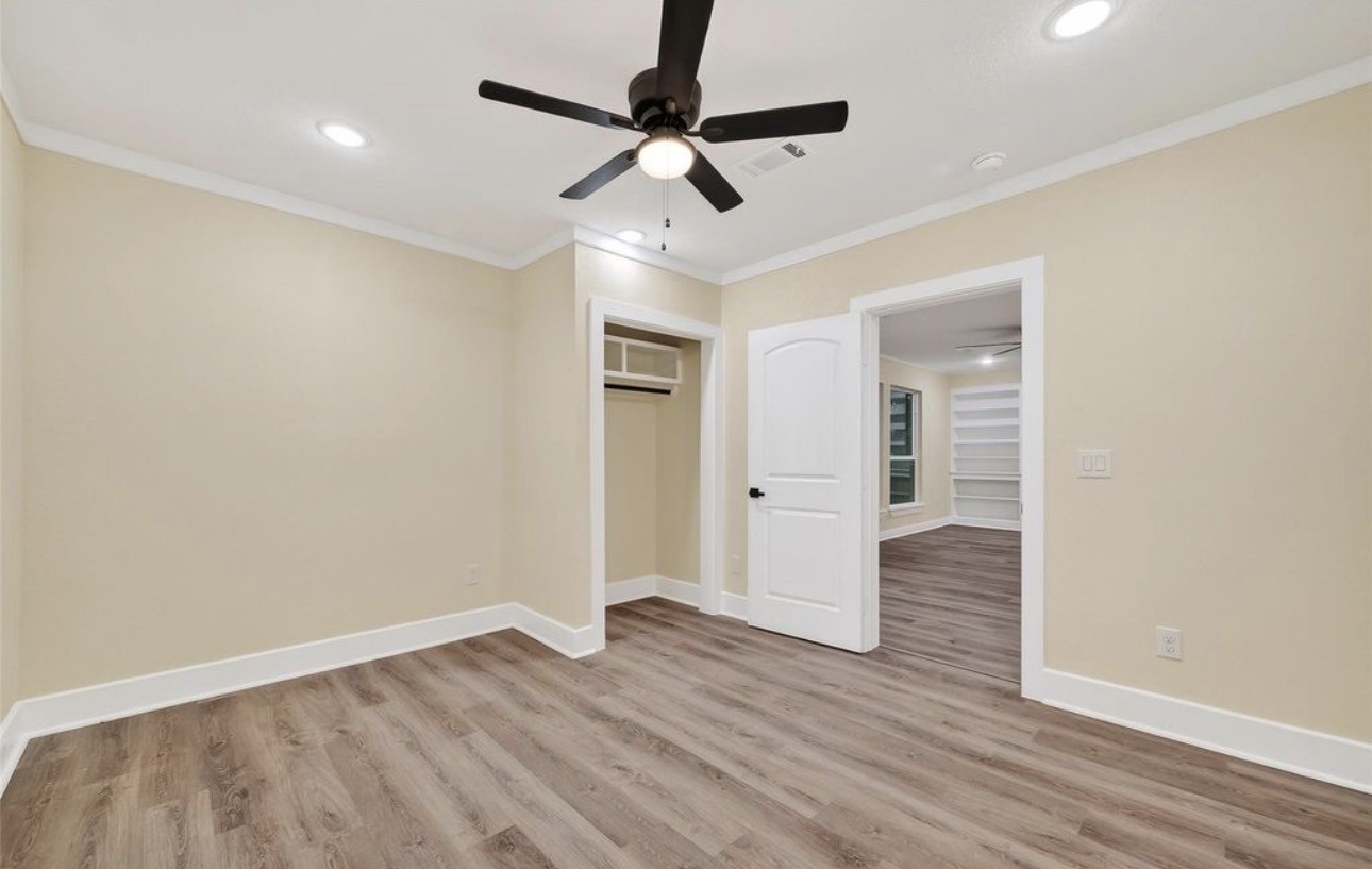 2725 Avenue F Rosenberg, TX 77471 - Photo 14 of 17 a view of empty room with wooden floor