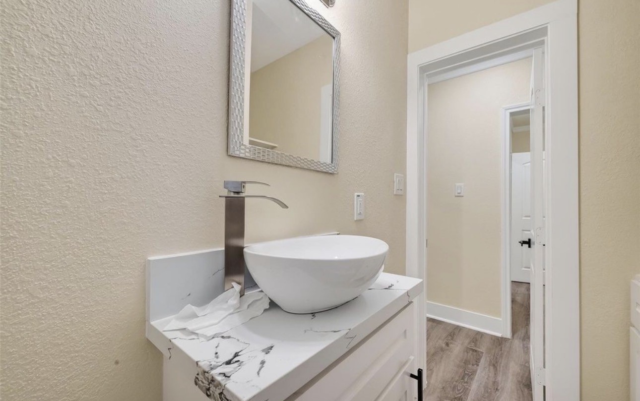 2725 Avenue F Rosenberg, TX 77471 - Photo 16 of 17 a bathroom with a sink and a mirror
