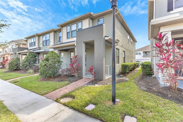 a front view of a house with garden