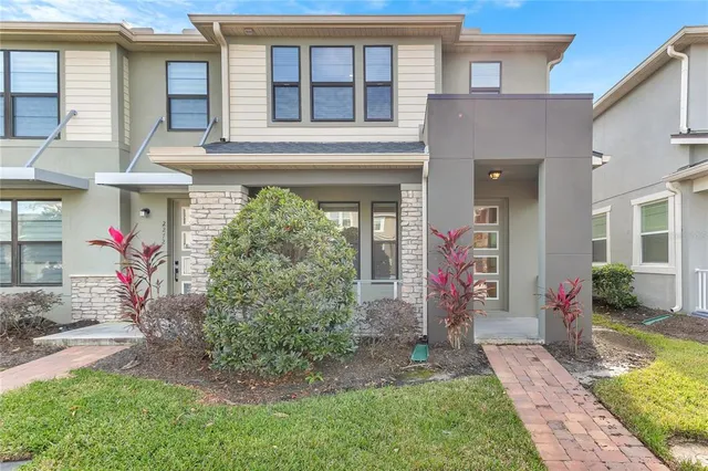 a front view of a house with garden