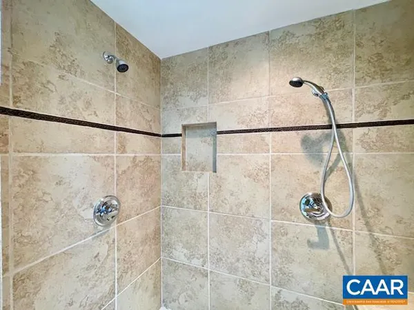 a bedroom with a large bed and a couch