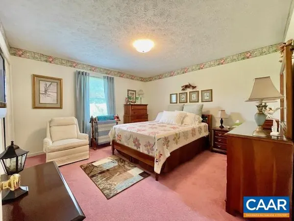 a bathroom with a sink mirror and vanity