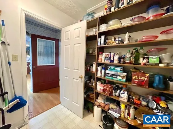 a kitchen with a stove a refrigerator and a sink
