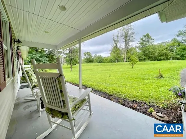 a view of a patio with a table chairs and a table