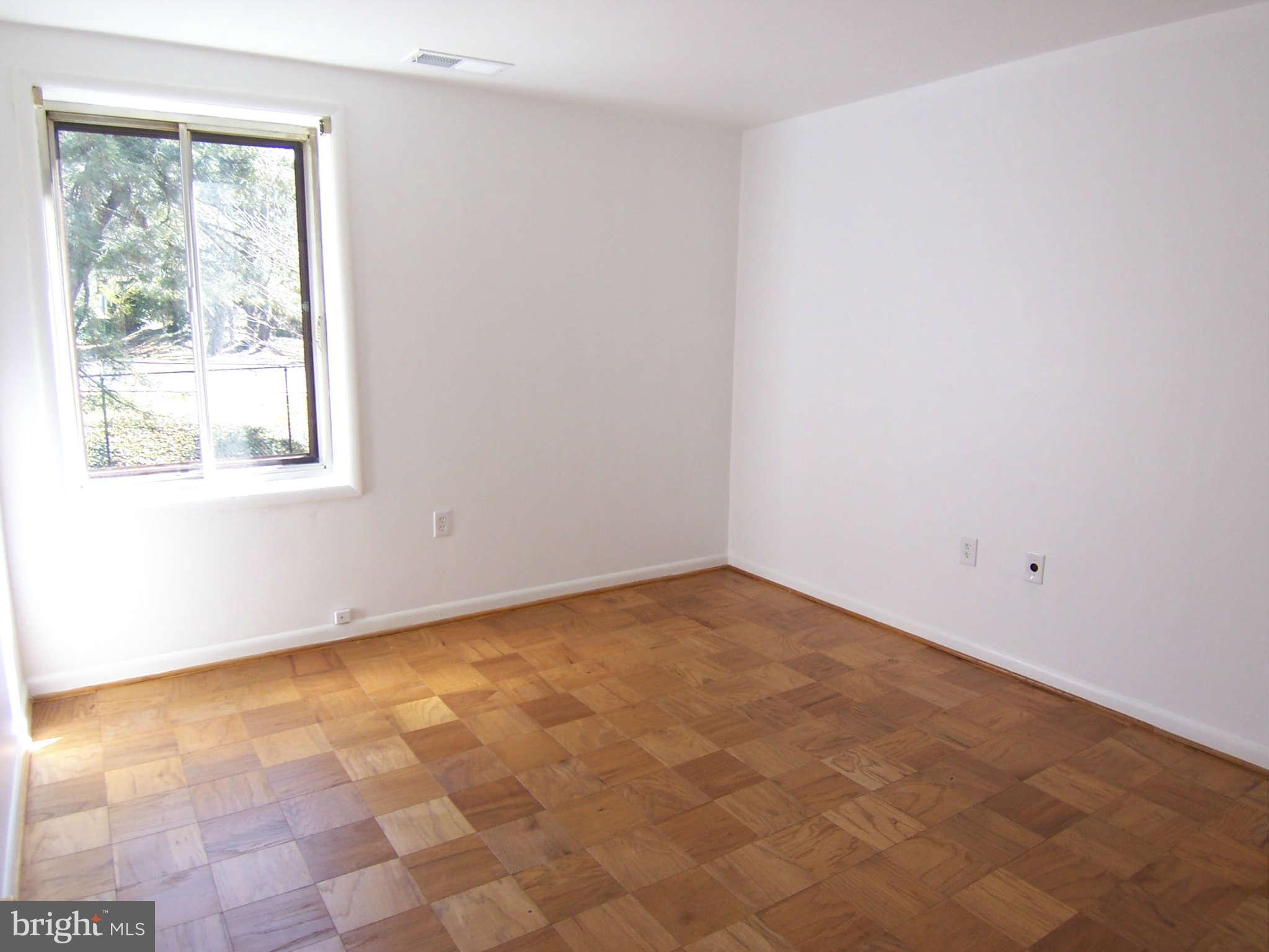 5 Cross Keys Road, Unit 5D Baltimore, MD 21210 - Photo 8 of 16 an empty room with a window