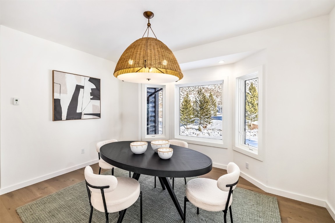 21 Stormwatch Circle Silverthorne, CO 80498 - Photo 14 of 43 a view of a dining room with furniture window and outside view