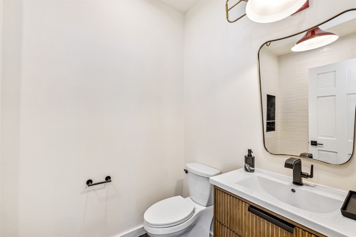 21 Stormwatch Circle Silverthorne, CO 80498 - Photo 23 of 43 a bathroom with a sink a toilet and mirror