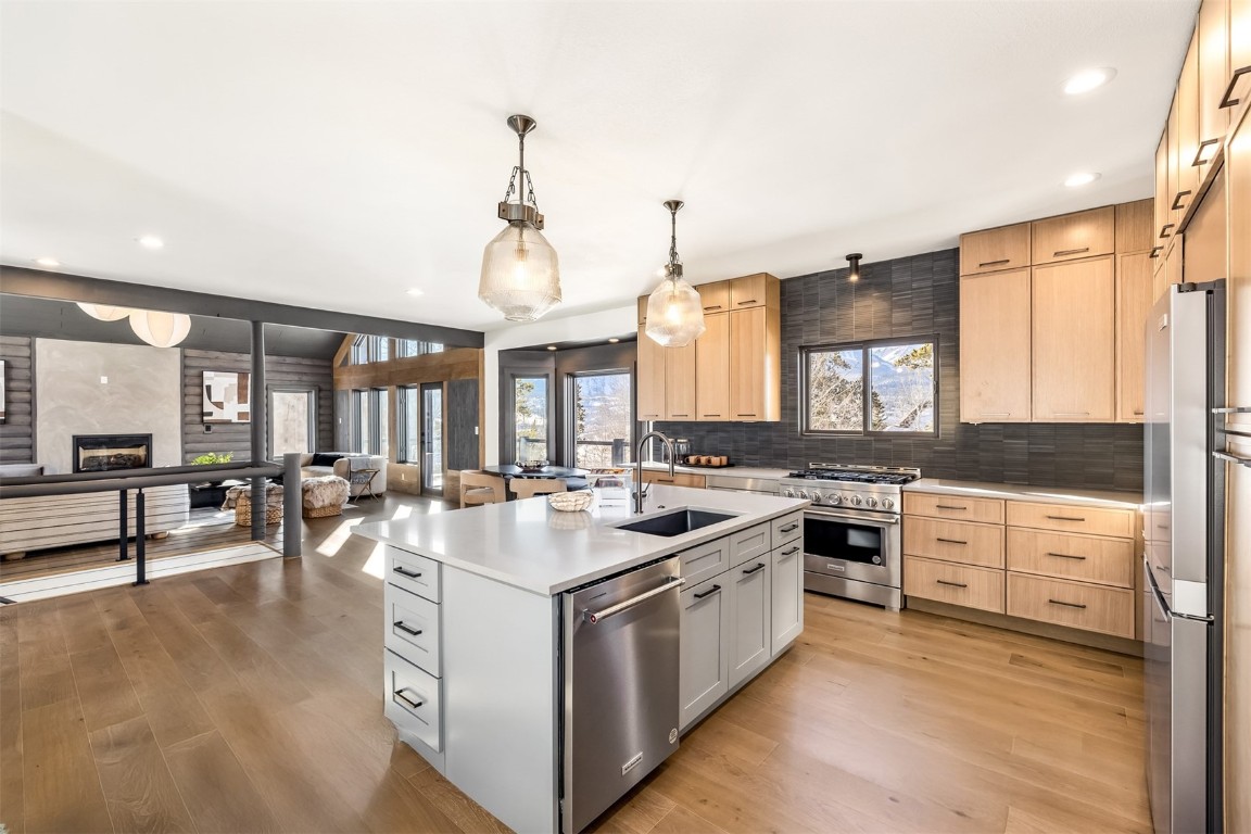 21 Stormwatch Circle Silverthorne, CO 80498 - Photo 25 of 43 a kitchen with stove a sink and cabinets