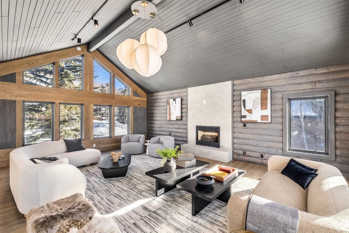 21 Stormwatch Circle Silverthorne, CO 80498 - Photo 28 of 43 a living room with furniture a fireplace and a large window