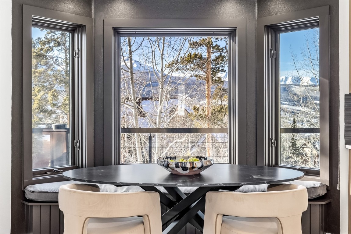 21 Stormwatch Circle Silverthorne, CO 80498 - Photo 9 of 43 a dining room with a window and chairs