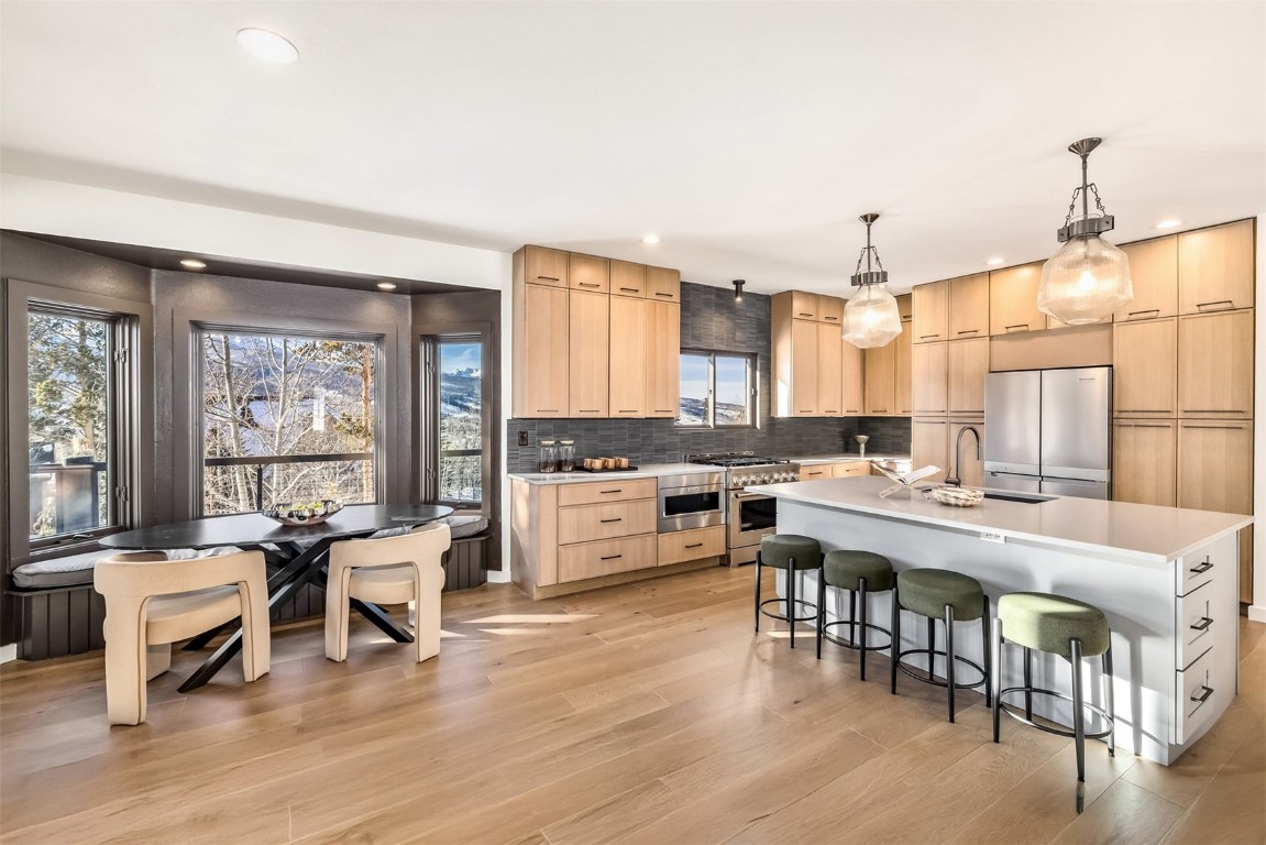 21 Stormwatch Circle Silverthorne, CO 80498 - Photo 10 of 43 a large kitchen with a table and chairs