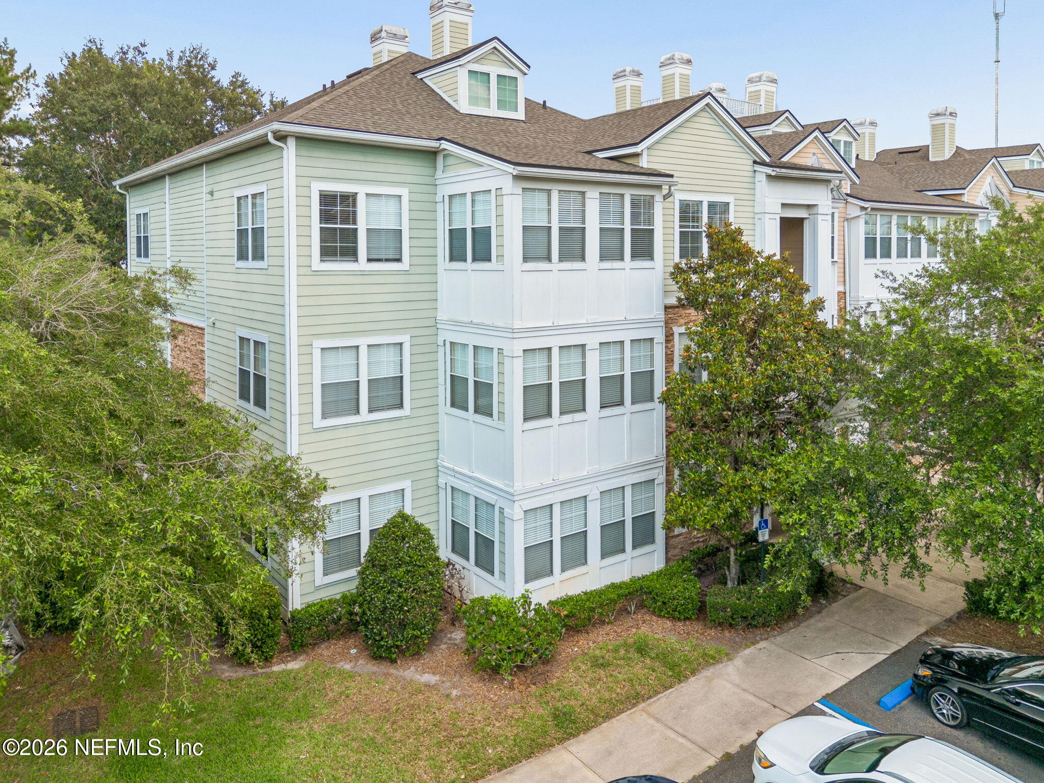 8550 Touchton Road, Unit 511 Jacksonville, FL 32216 - Photo 4 of 63 a front view of a house with a yard