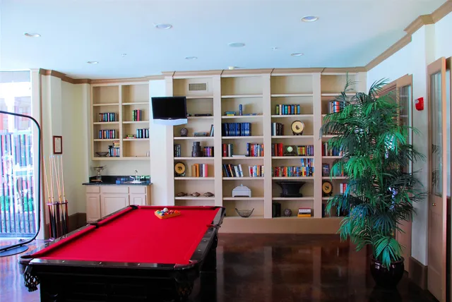 a room with bookshelf and furniture