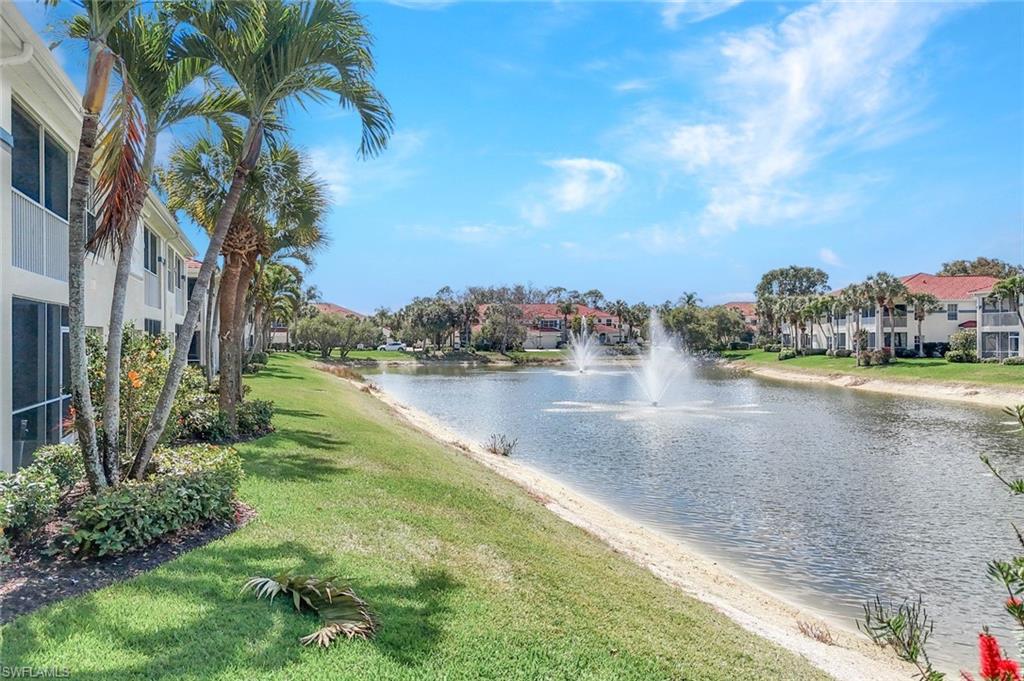 23731 Old Port Road, Unit 103 Estero, FL 34135 - Photo 17 of 30 a view of a lake with houses in the background