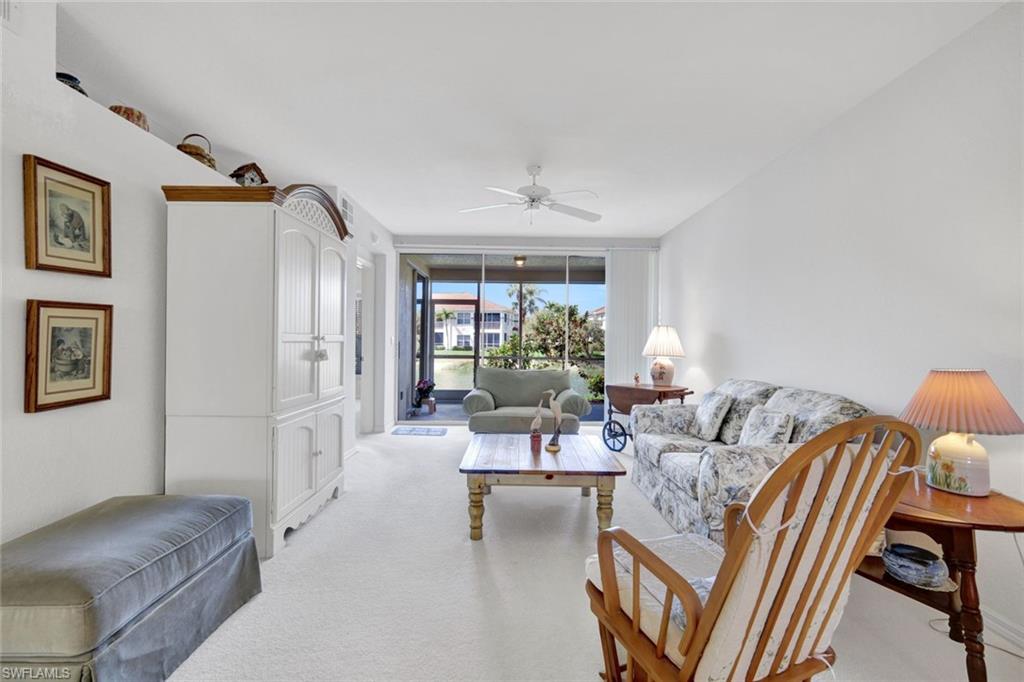 23731 Old Port Road, Unit 103 Estero, FL 34135 - Photo 3 of 30 a living room with furniture and a window