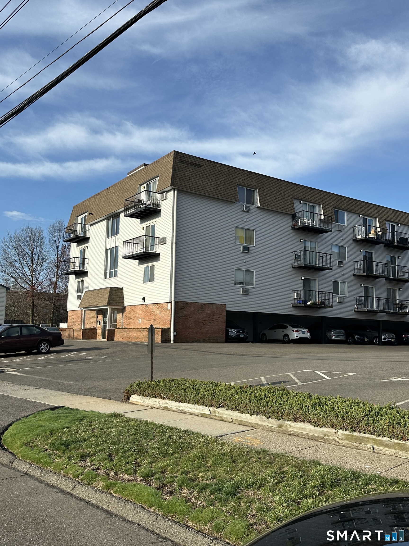155 Short Beach Road, Unit 102 Stratford, CT 06615 - Photo 2 of 8 Assigned Parking and Carport make parking extremely easy!