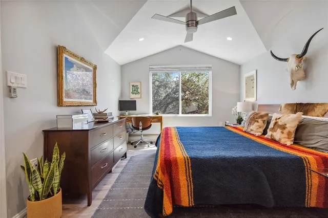 a dining room with furniture and a window