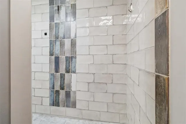 a bed room with a bed and a painting on the wall