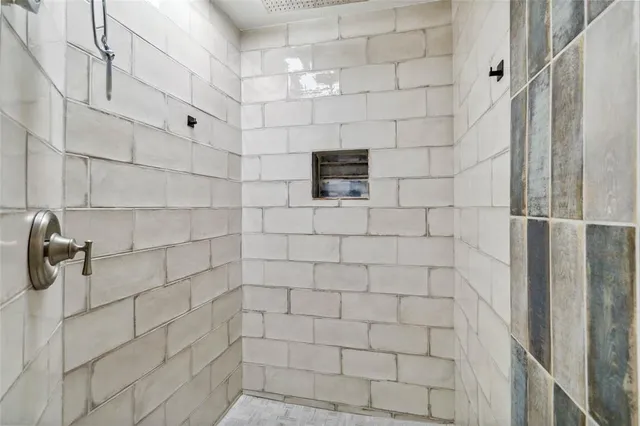 a bathroom with a sink vanity and mirror