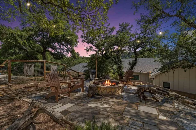 a view of a yard with cars parked