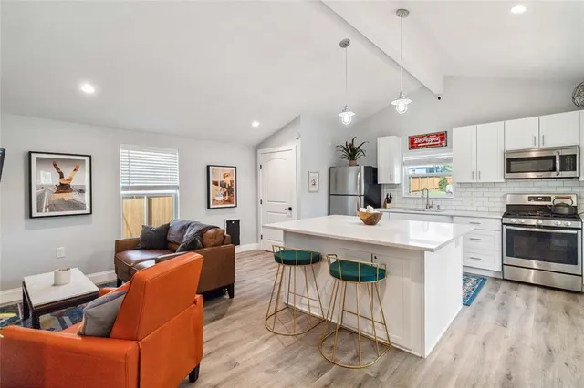 a view of a backyard with large trees