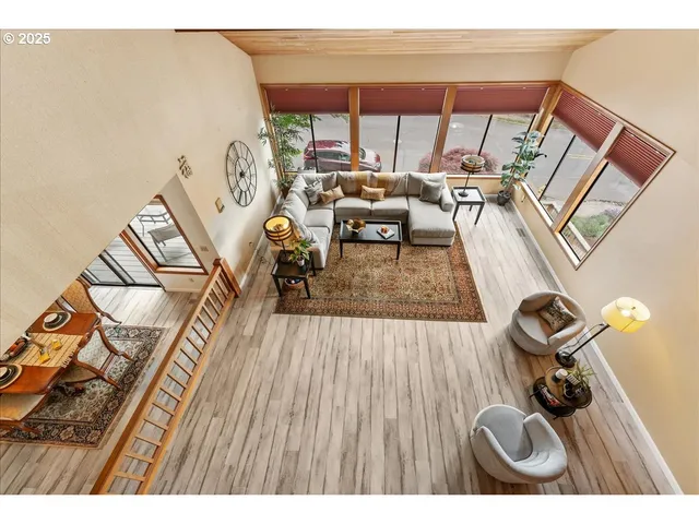 a view of a living room and a wooden floor