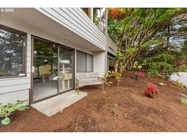 a backyard of a house with outdoor seating