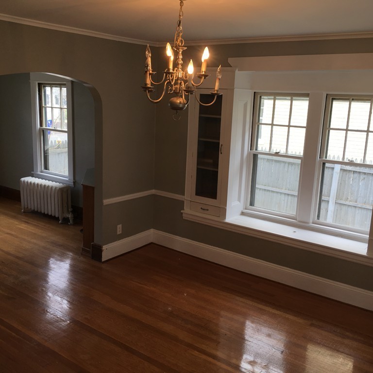 101 Belvidere Street Springfield, MA 01108 - Photo 14 of 15 a view of an empty room with wooden floor and a window