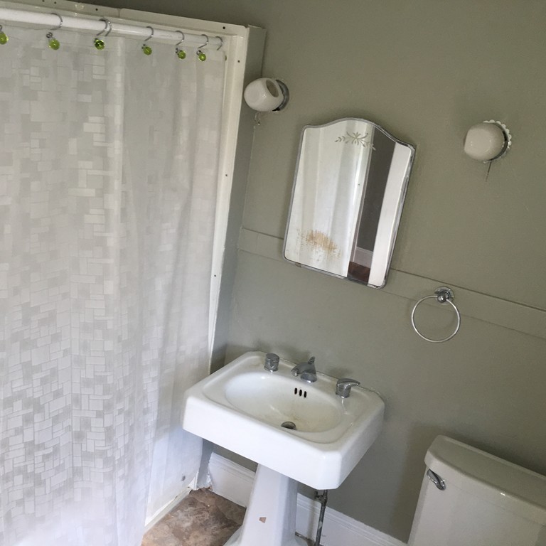 101 Belvidere Street Springfield, MA 01108 - Photo 9 of 15 a bathroom with a sink a toilet and mirror