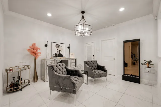 a view of a livingroom with furniture and a chandelier