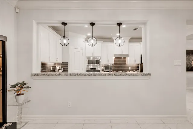 a view of a kitchen and dining room