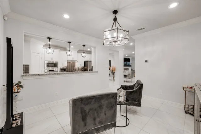 a view of a kitchen with stainless steel appliances granite countertop counter space a sink and cabinets
