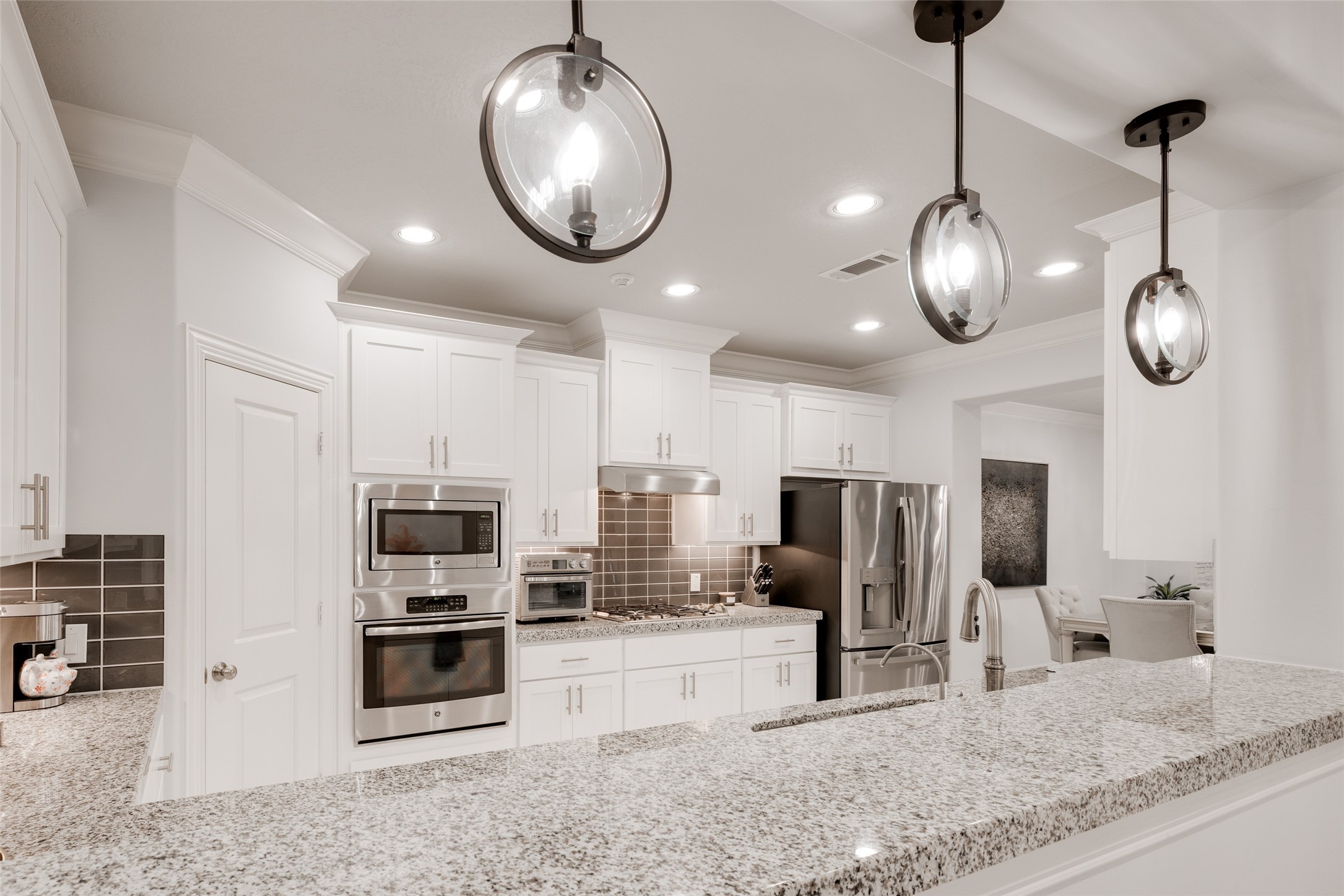 13611 Teal Bluff Lane Houston, TX 77077 - Photo 18 of 46 a view of a kitchen with stainless steel appliances granite countertop counter space a sink and cabinets