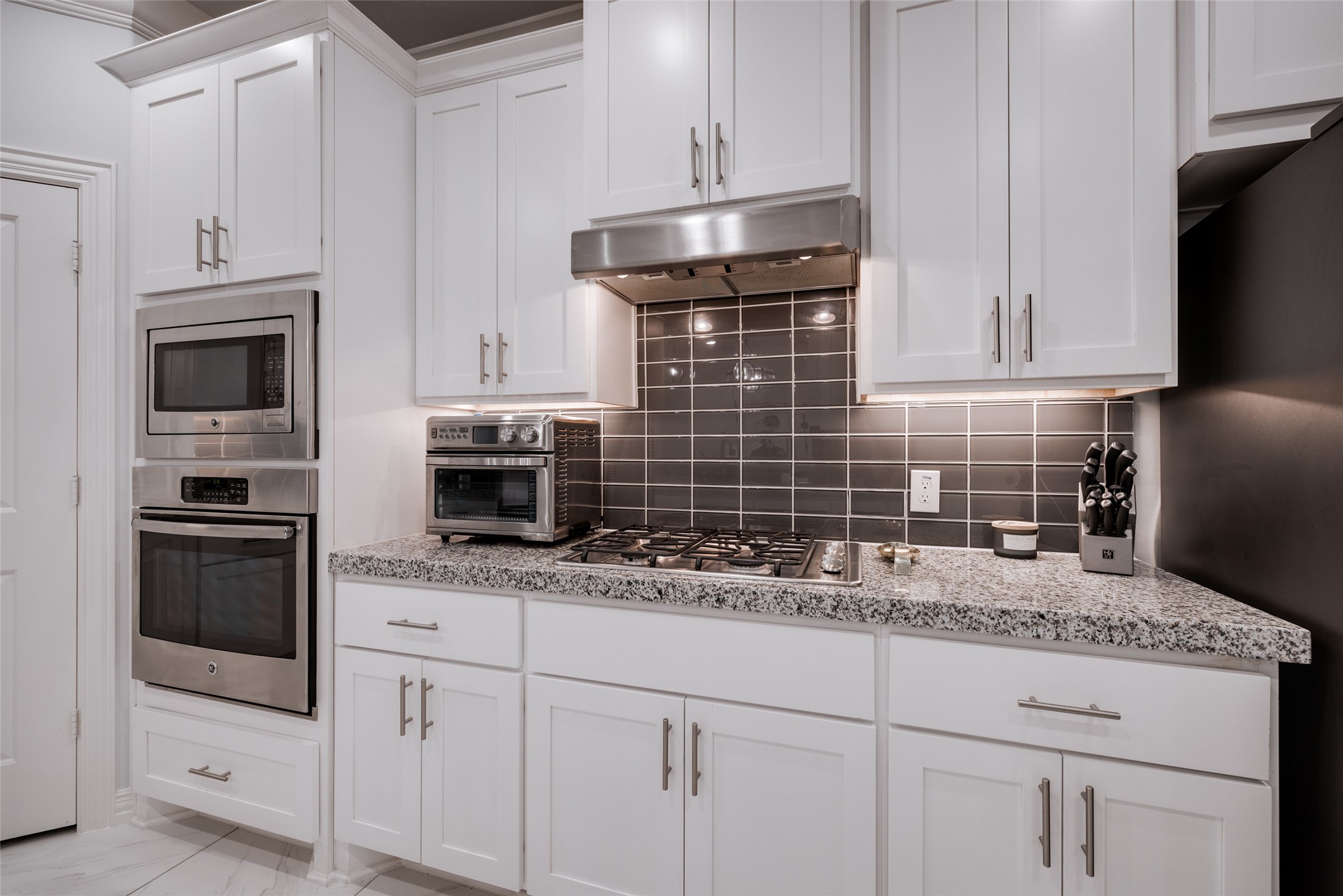 13611 Teal Bluff Lane Houston, TX 77077 - Photo 22 of 46 a kitchen with granite countertop a sink stainless steel appliances and cabinets