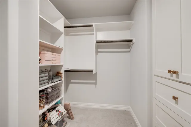 a dining room with furniture and a potted plant