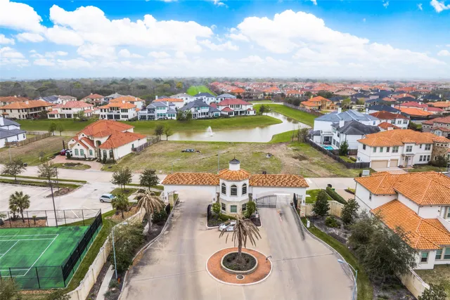 an aerial view of a house with outdoor space