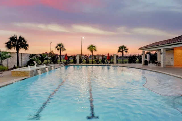 a view of a park with swings and slides
