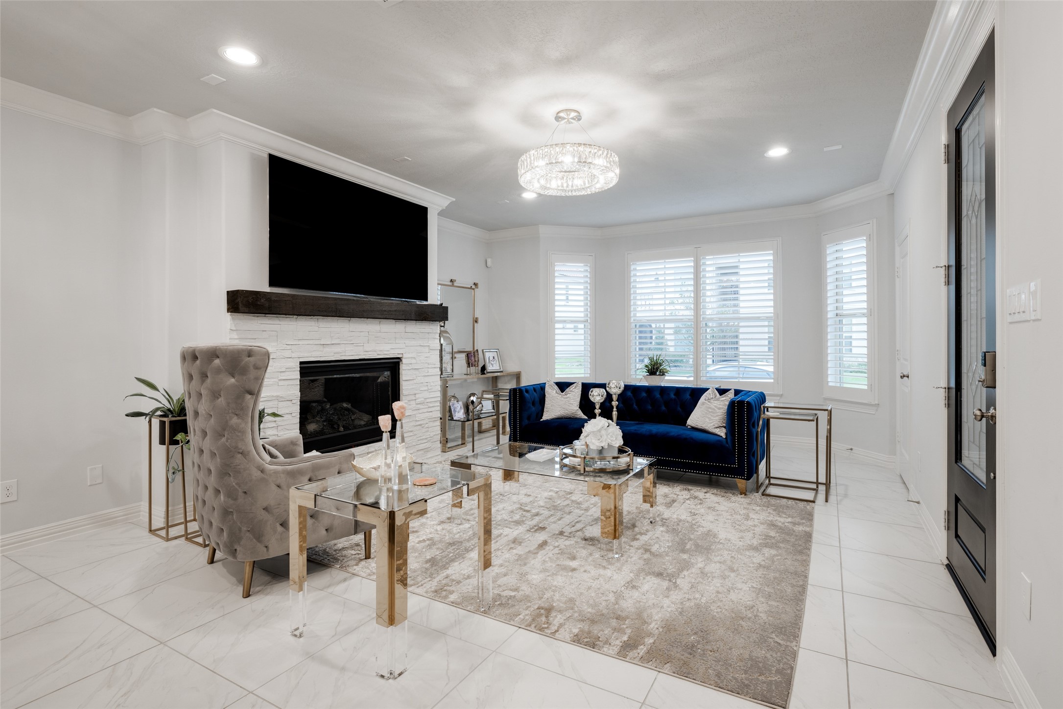 13611 Teal Bluff Lane Houston, TX 77077 - Photo 10 of 46 a living room with furniture a flat screen tv and a fireplace