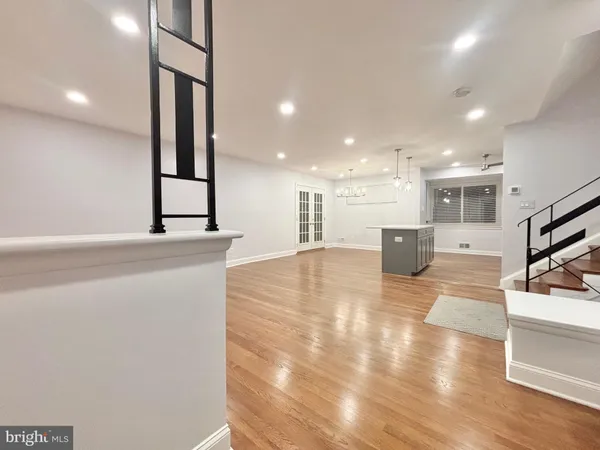 a lobby with a couch and a view of living room