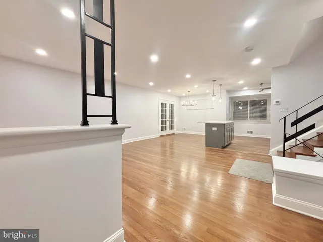 a lobby with a couch and a view of living room