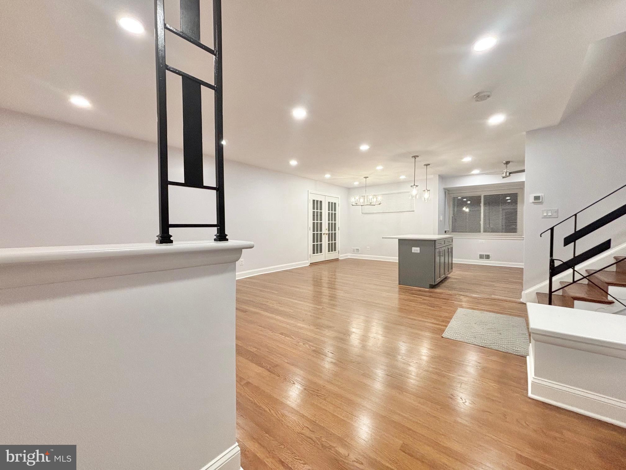 a lobby with a couch and a view of living room